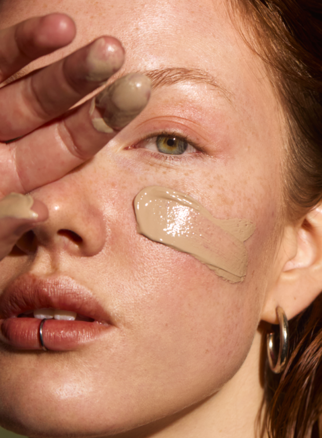 tinted mineral sunscreen applied on woman's face